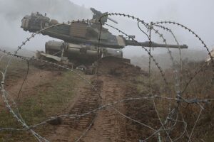 Combined_Resolve_V_1Abram-Tank-Barbwire-NATO-maneuvers-SRC-US-Army-public-domain