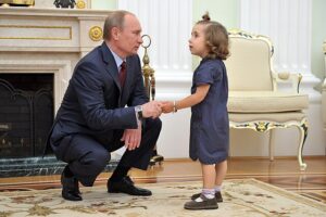 You all are probably wondering why I used this photo of President Putin talking to this innocent child named Vera Smolnikova. I’m setting the mood. Source: Kremlin.ru, © Creative Commons.